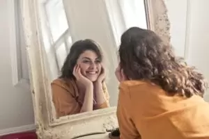 healthy-woman-looking-in-mirror